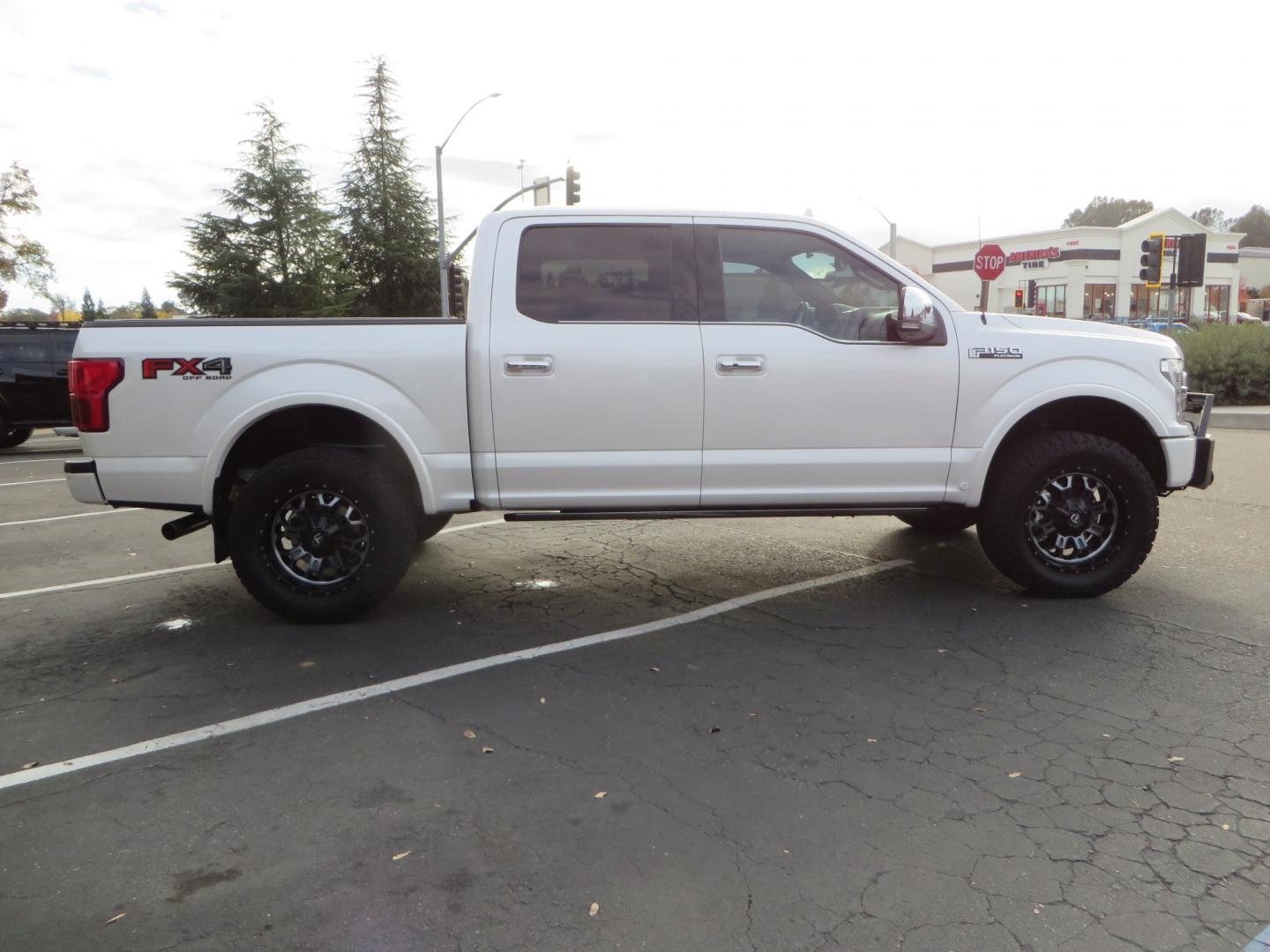 2019 White /BLACK INT W/DARK MARSALA LT Ford F-150 Platinum SuperCrew Cab 4WD (1FTEW1E45KF) with an 3.5L V6 ECOBOOST engine, 10-SPEED AUTO W/TOW MO transmission, located at 2630 Grass Valley Highway, Auburn, CA, 95603, (530) 508-5100, 38.937893, -121.095482 - F150 Platinum featuring a level kit, Fuel Offroad wheels, Toyo AT2 tires, Barricade Front winch bumper, Smittybilt winch, LED light bar, Undercover Ultraflex bedcover, and a Cargo Glide bed system. - Photo#3